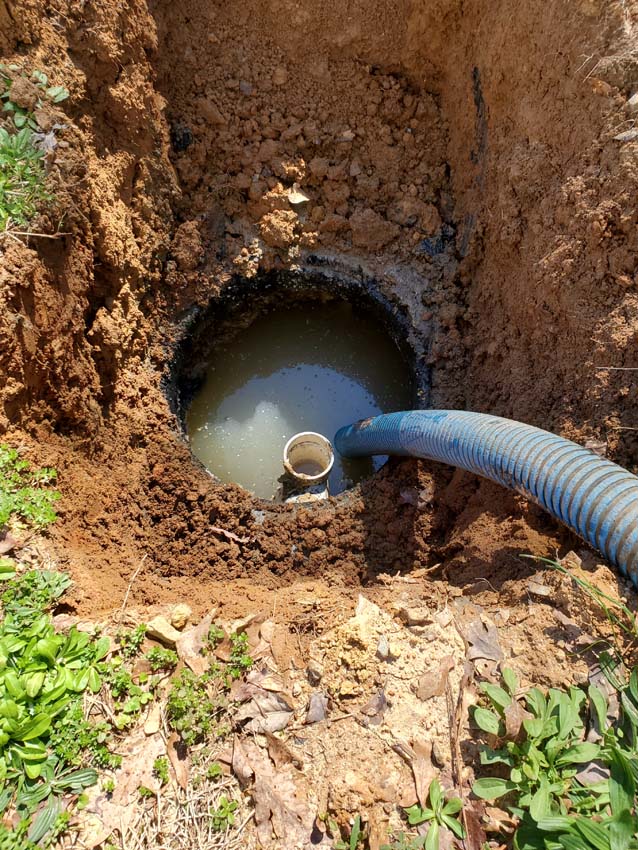Presence of sewage or wastewater pooling on the surface near the septic tank